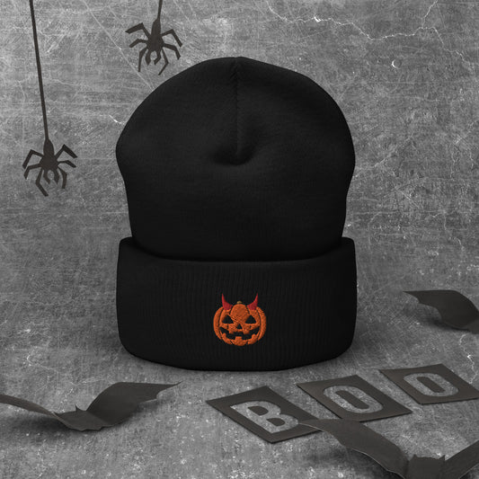 A black cuffed Halloween beanie featuring an embroidered jack-o-lantern wearing devil horns