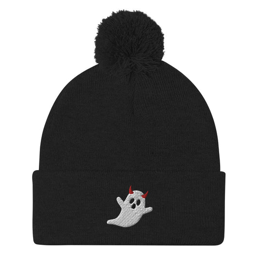 A black cuffed Halloween beanie with a pom-pom on top, featuring an embroidered ghost wearing devil horns