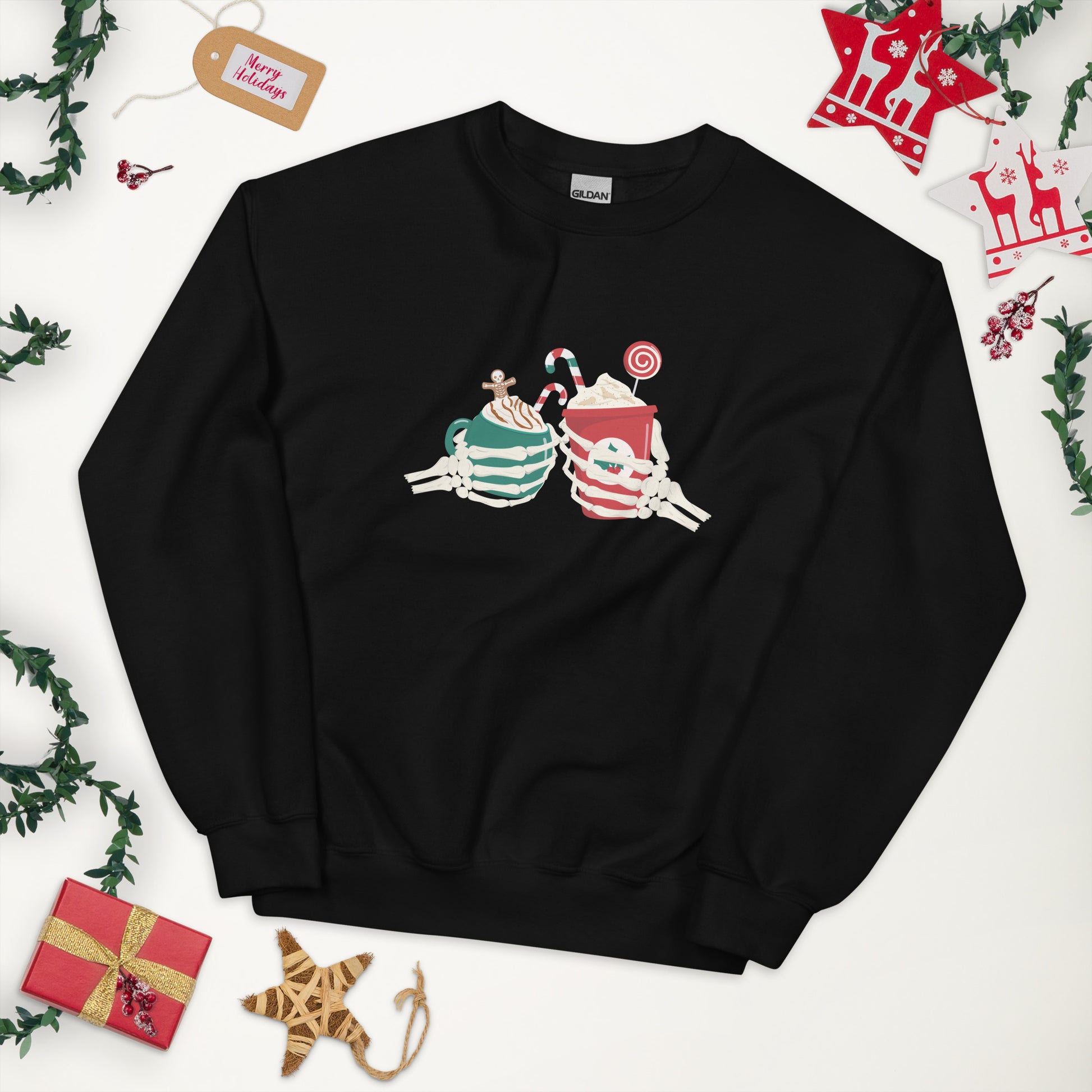 A black crewneck sweatshirt featuring two skeleton hands holding Christmas themed coffees