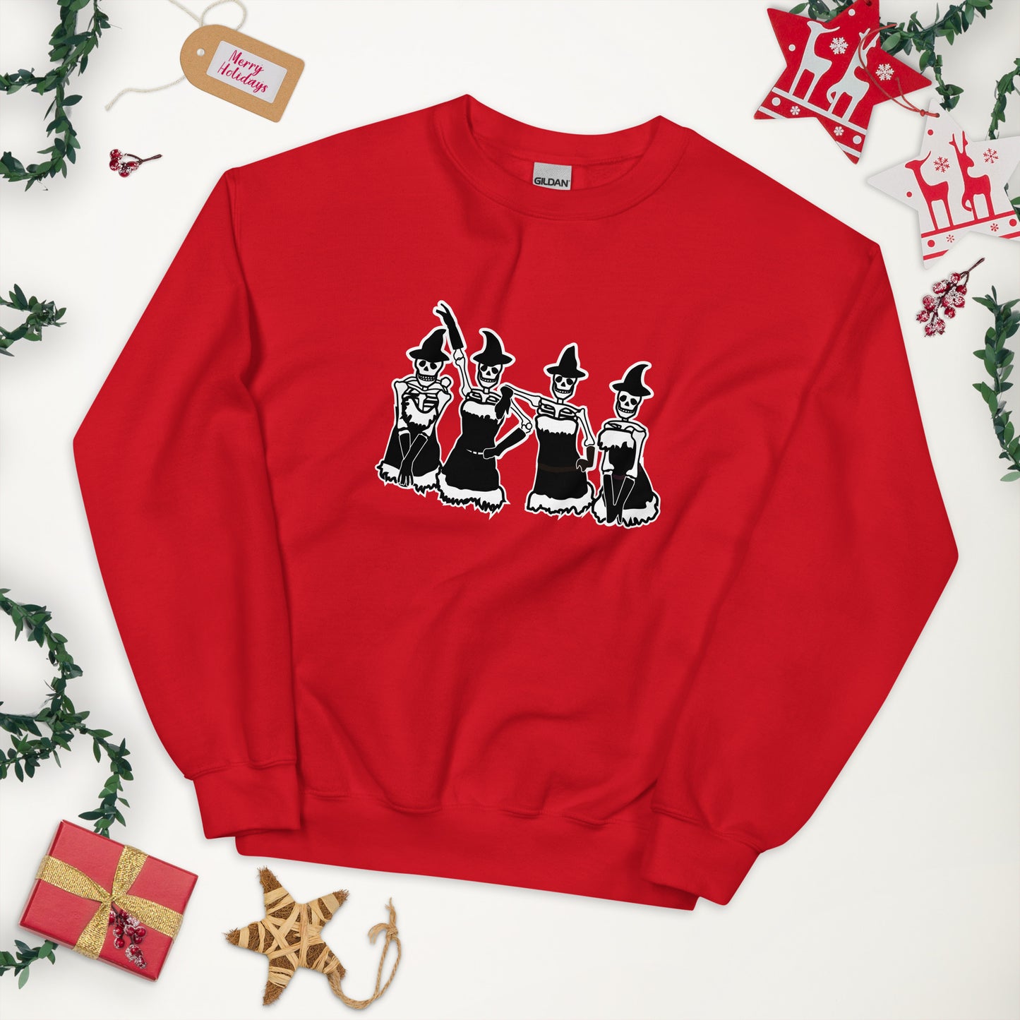 A red crewneck sweatshirt featuring a Mean Girls inspired lineup of skeletons wearing Santa dresses and witch hats