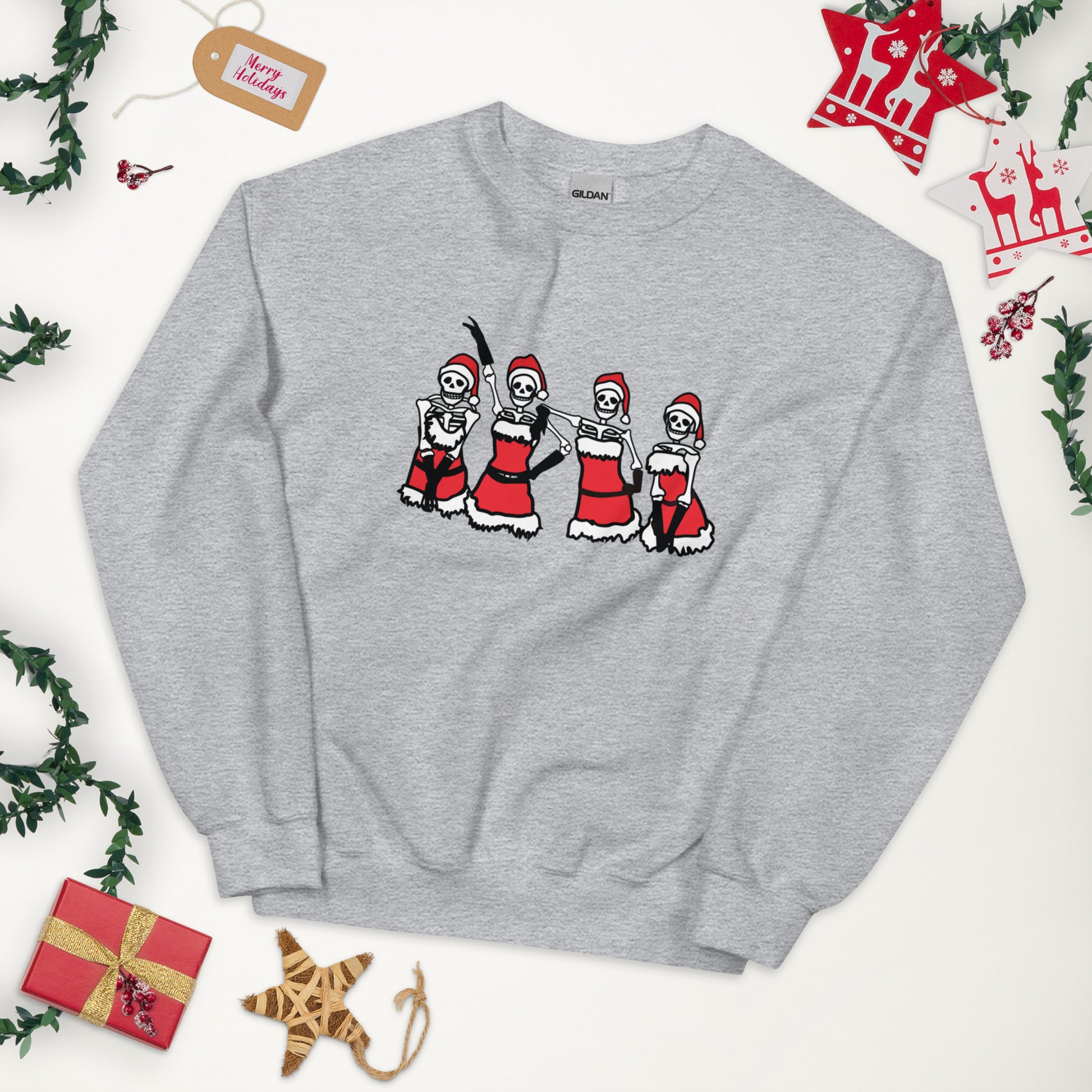 A gray crewneck sweatshirt with a Mean Girls inspired lineup of skeletons wearing the Santa outfits from the Christmas talent show