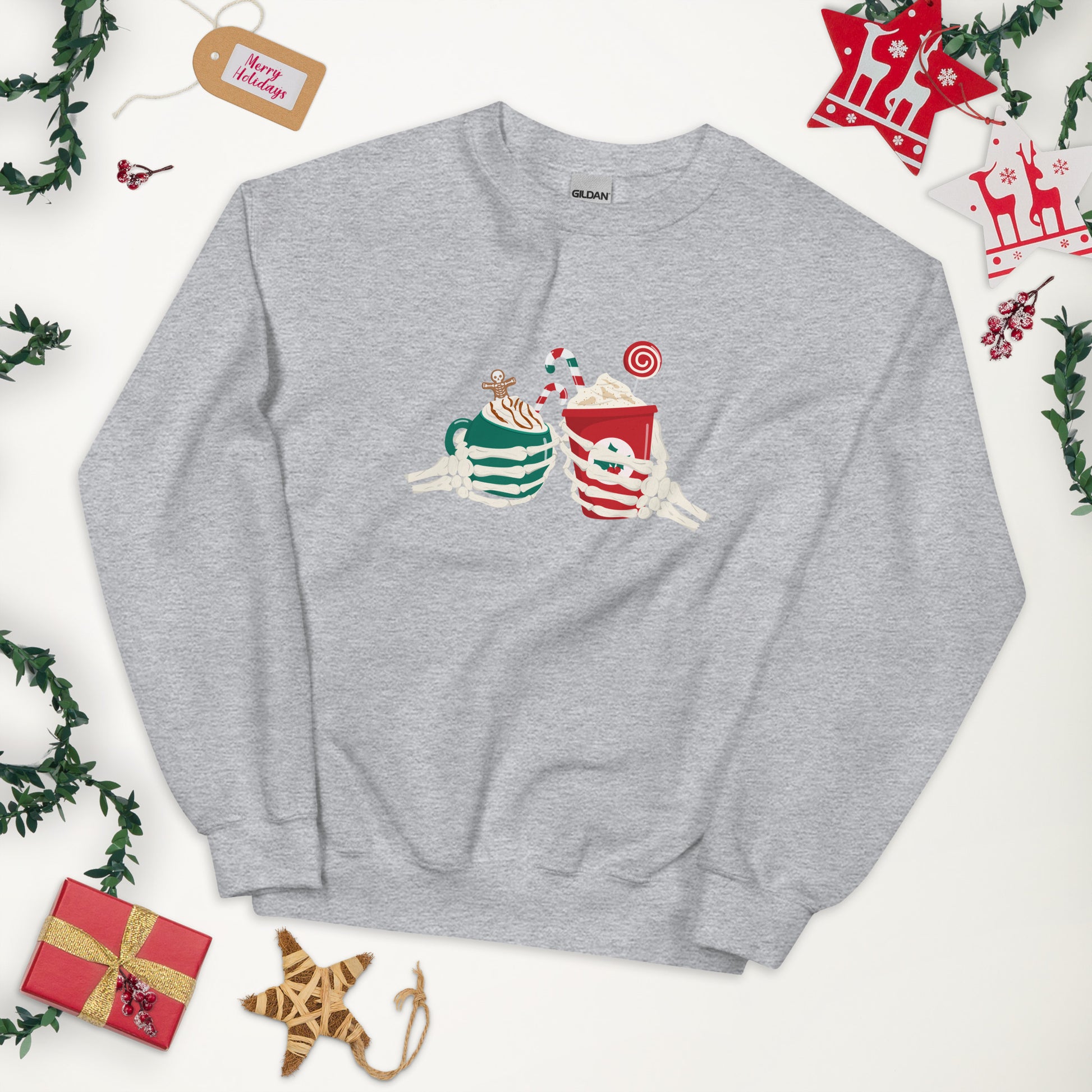 A gray crewneck sweatshirt featuring two skeleton hands holding Christmas themed coffees