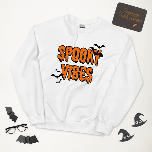 A white Halloween crewneck sweatshirt that says "spooky vibes" in a creepy, dripping orange font, surrounded by bats