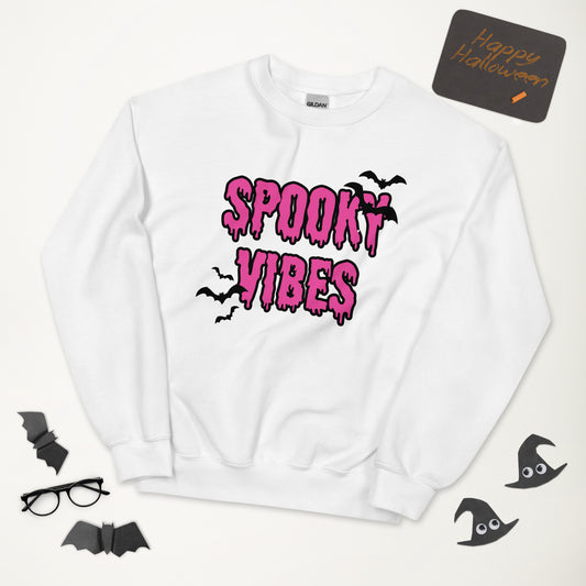 A white Halloween crewneck sweatshirt that says "spooky vibes" in a creepy, dripping bright pink font, surrounded by bats