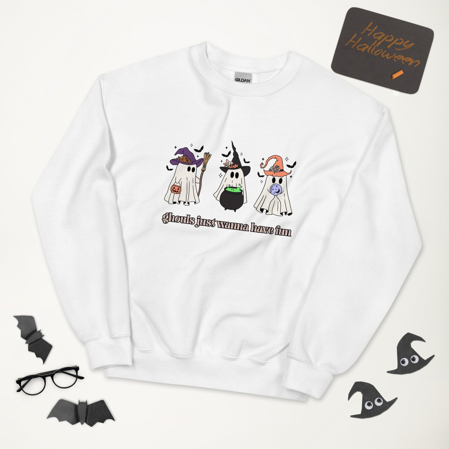 A white Halloween crewneck sweatshirt, featuring three adorable ghosts all dolled up in costumes, with the phrase "ghouls just wanna have fun" underneath