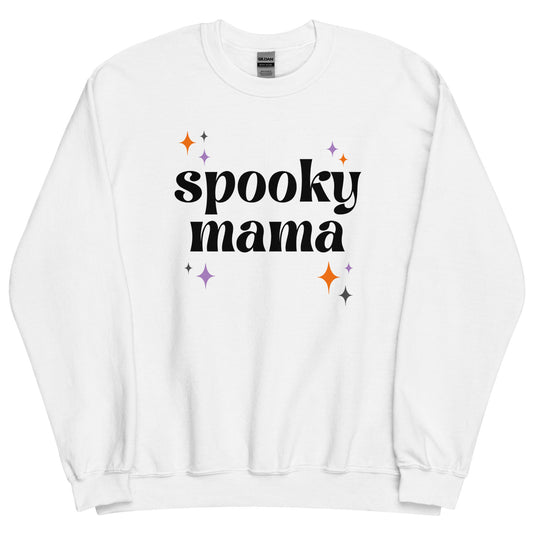 A white crewneck sweatshirt that says "spooky mama" in a black retro font, surrounded by orange and purple "sparkles"