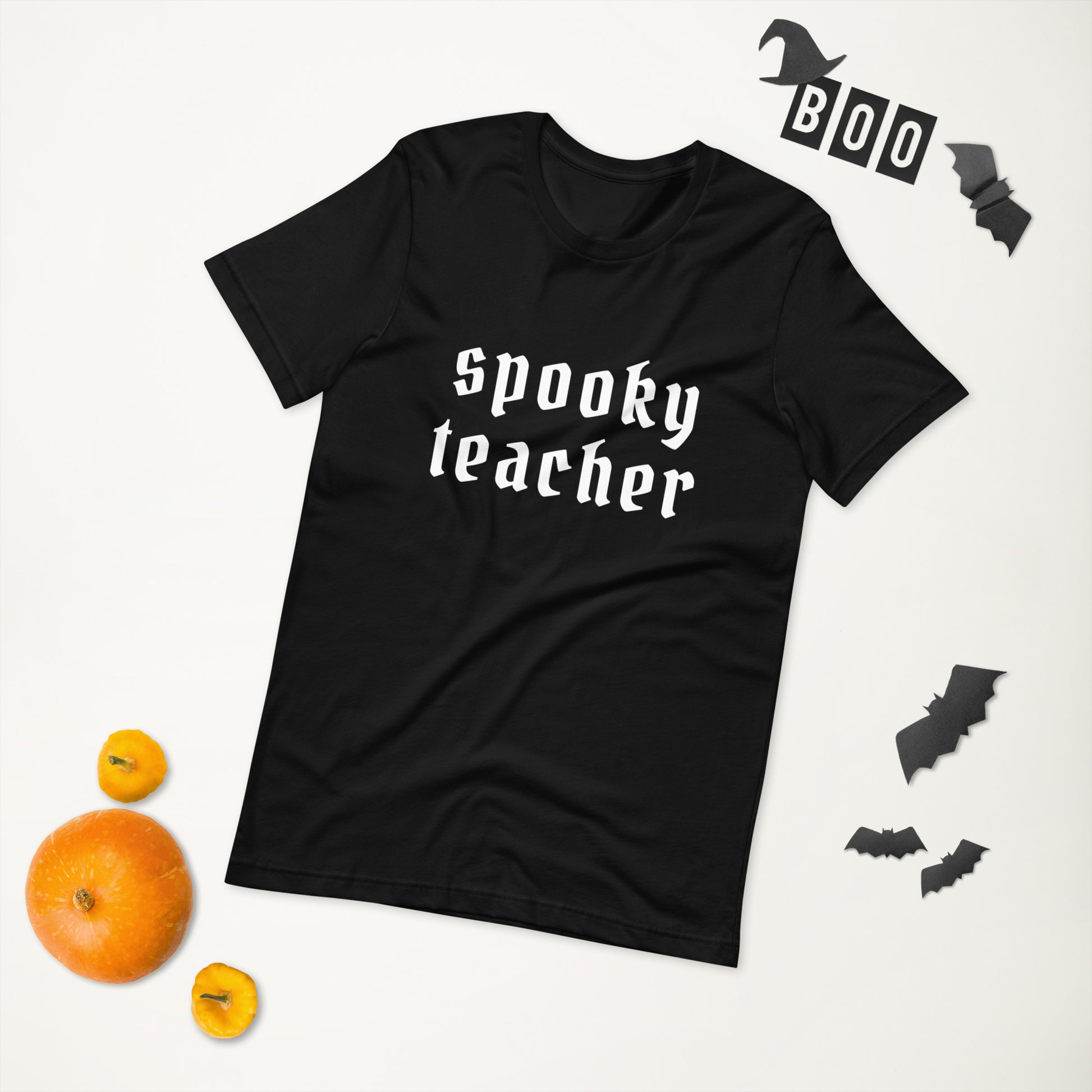 A black t-shirt that says "spooky teacher" in a gothic white font