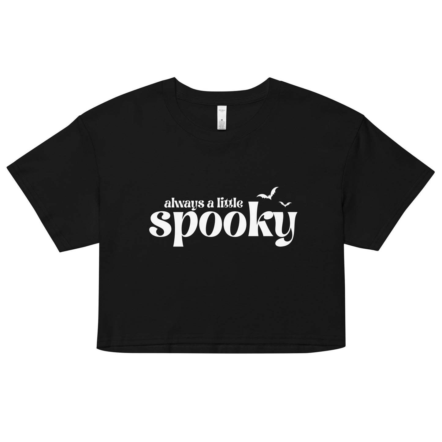 A black, cropped t-shirt that says "always a little spooky" in a trendy white font