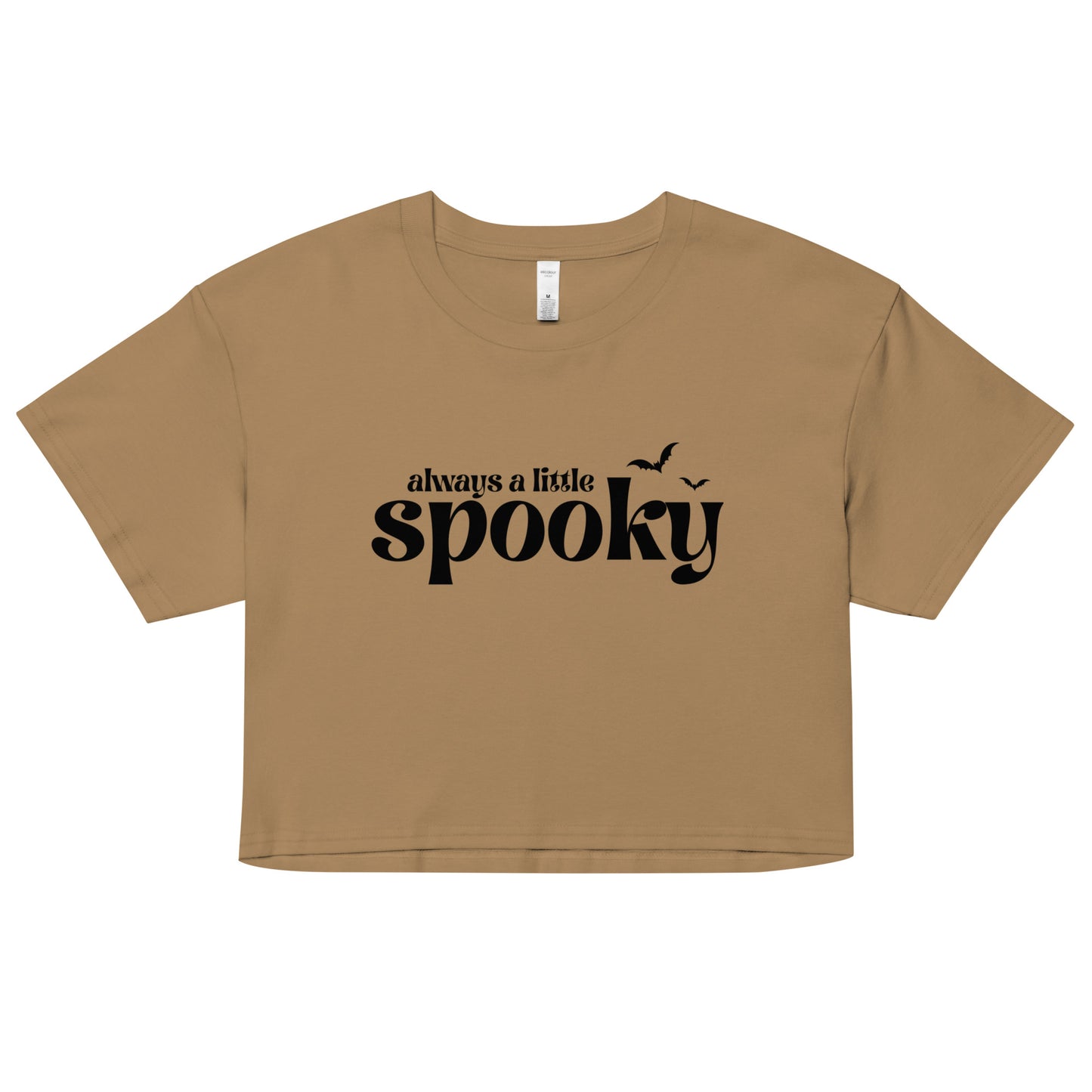A tan, cropped t-shirt that says "always a little spooky" in a trendy black font