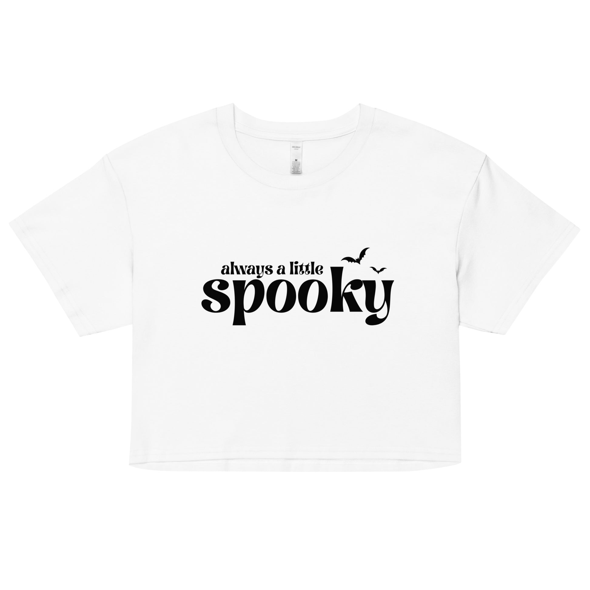 A white, cropped t-shirt that says "always a little spooky" in a trendy black font