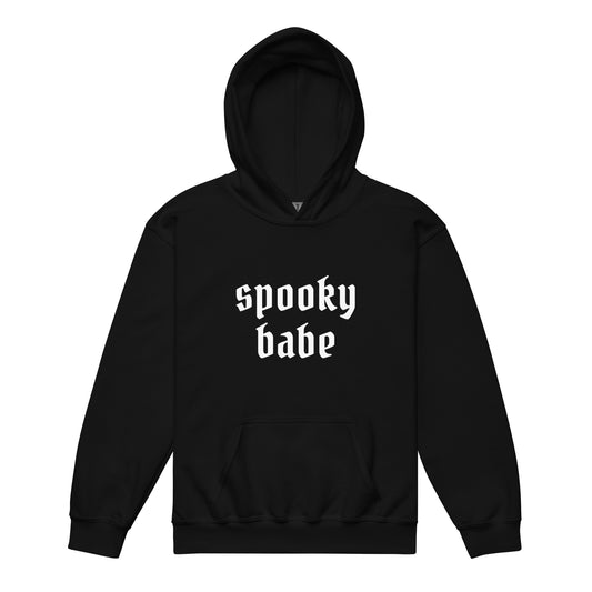 A black kids' hoodie that says "spooky babe" in a gothic white font