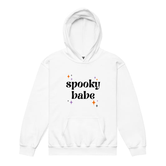 A white kids' hoodie that says "spooky babe" in a retro black font, surrounded by orange and purple "sparkles"