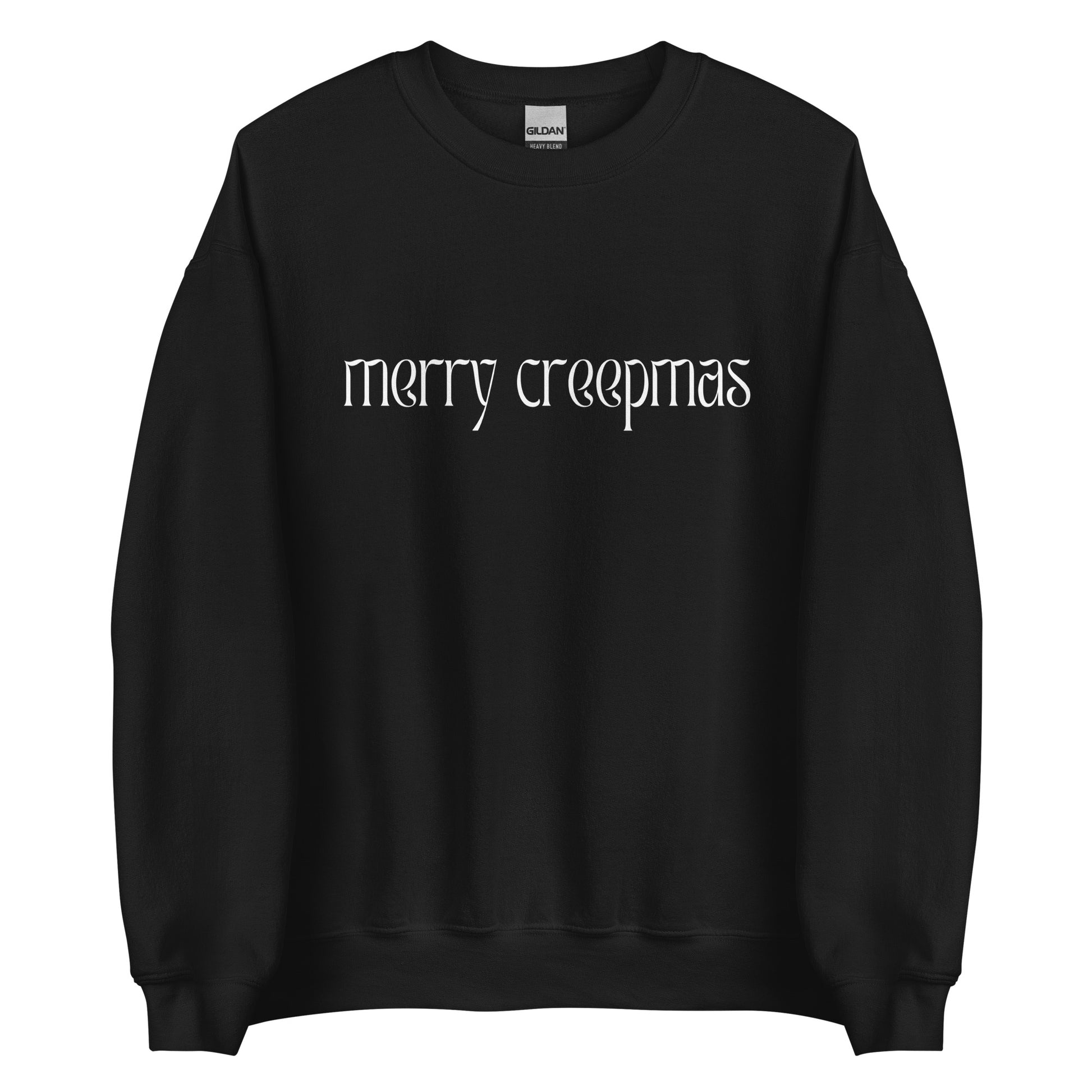 A black Christmas sweater with the phrase Merry Creepmas written in all lowercase white letters