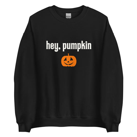 A black Halloween crewneck sweatshirt with the words Hey Pumpkin written in white, with a cute orange jack-o-lantern underneath