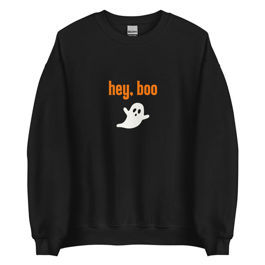 A black Halloween crewneck sweatshirt with the words Hey Boo written in orange, and a cute white ghost underneath